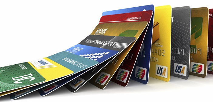 Credit cards in a row falling - credit card debt concept